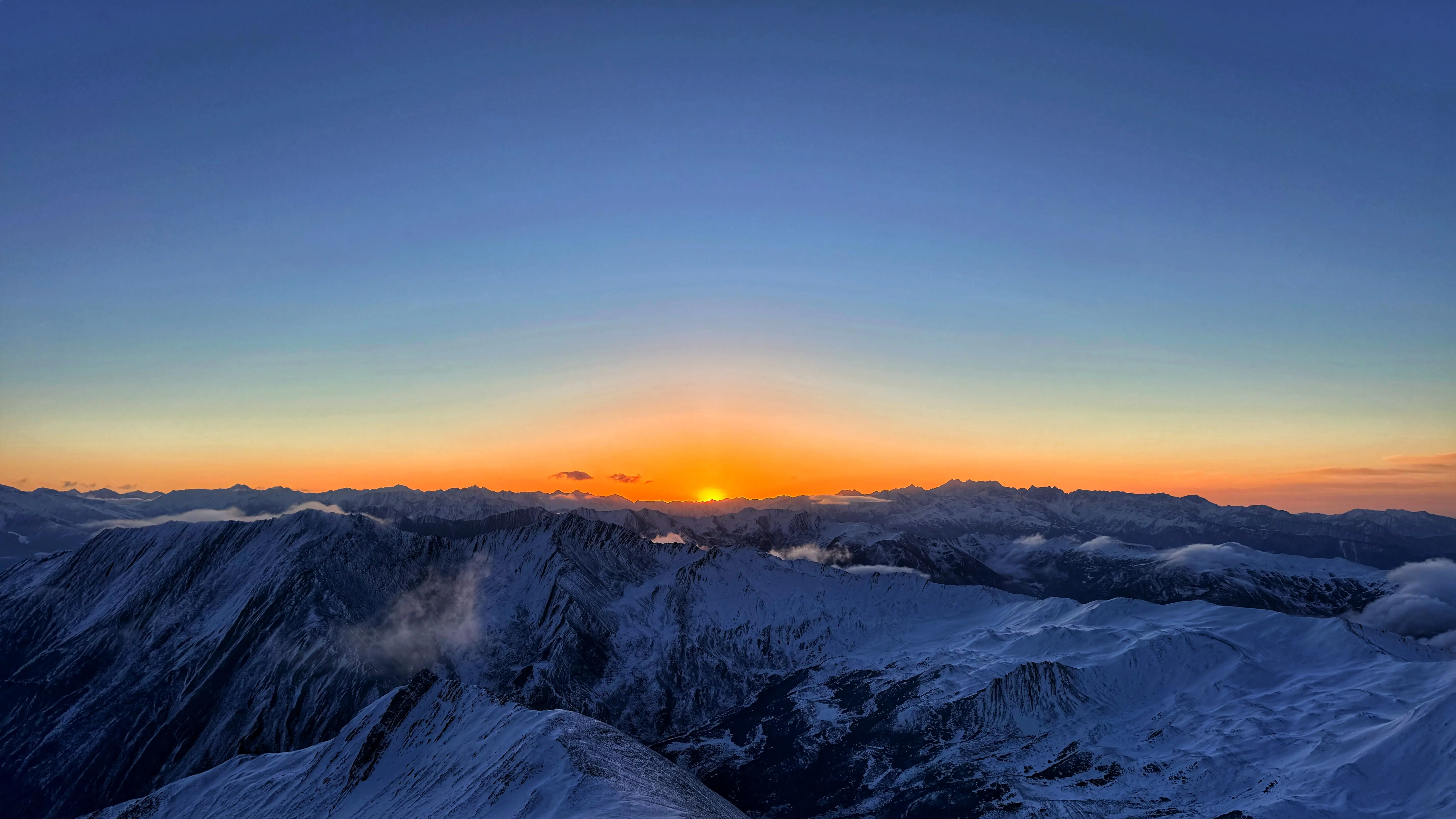 Sunrise over snow-capped peak